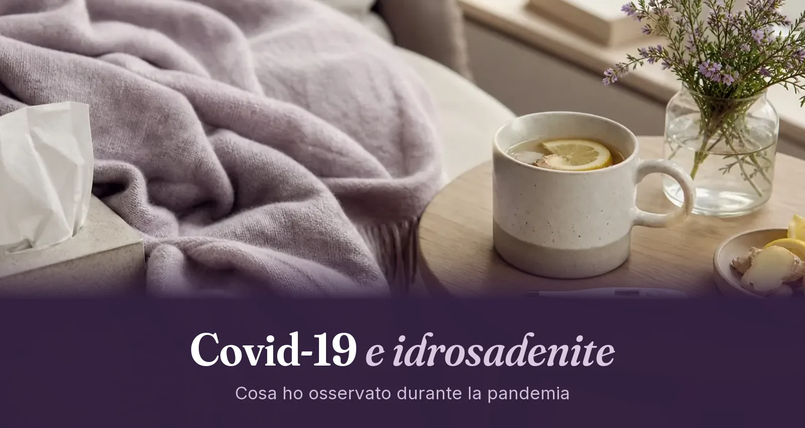 Divano con coperta, fazzoletti, termometro e tisana al limone con zenzero su un tavolino